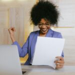 Woman Holding A Paper